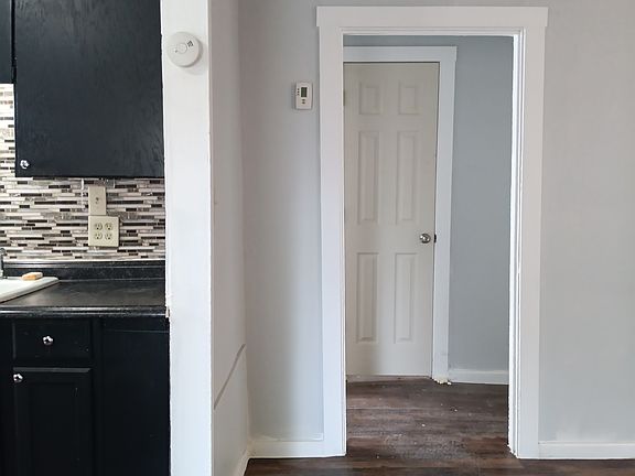 Bathroom is in hallway between the bedrooms.