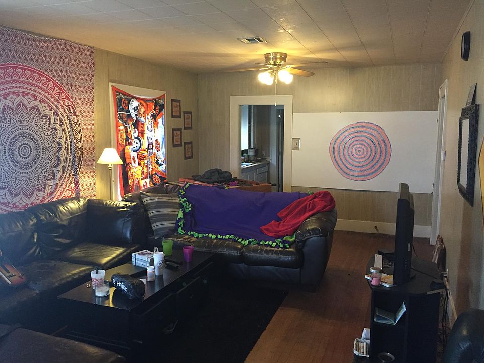 Large living room with brick floors