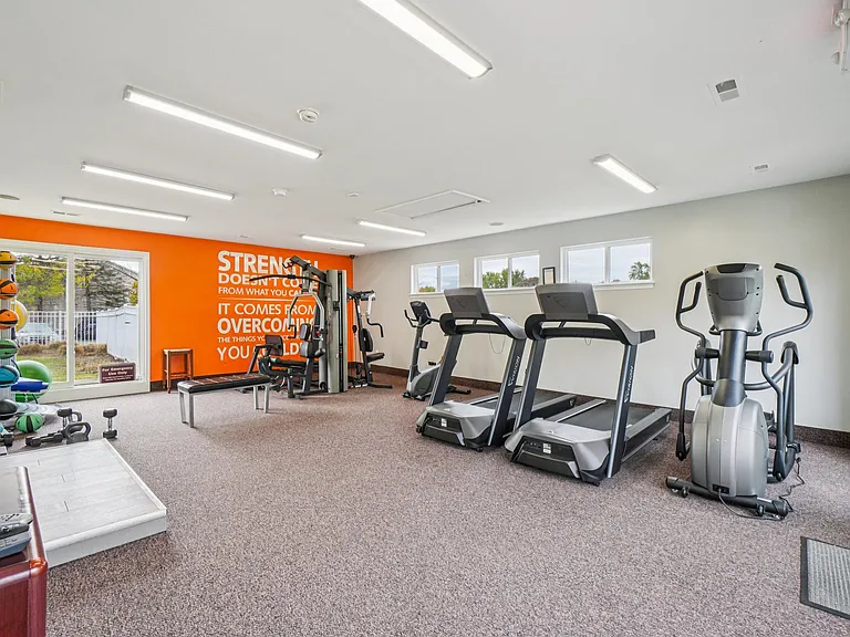 Stay fit in our comprehensive fitness center with treadmills, bikes, and weight machines, professionally operated by Highlands Vista Group.