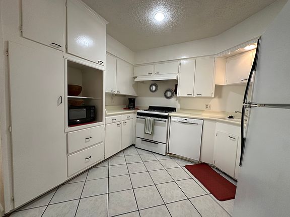 Spacious kitchen with abundant cabinet and storage space, designed to keep everything organized and accessible.