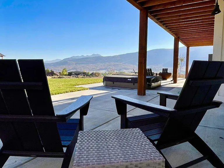 Outside patio with furniture and private hot tub