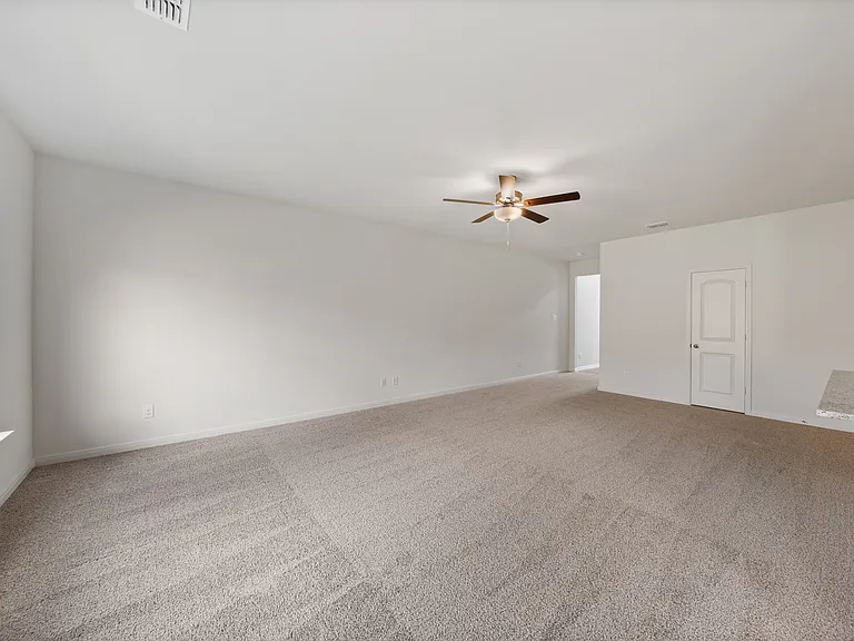 The spacious family room is perfect for family living and hosting.