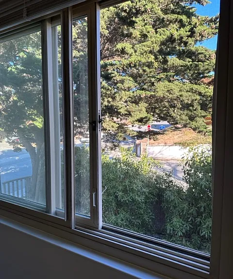 Master bedroom window overlooking quiet patio