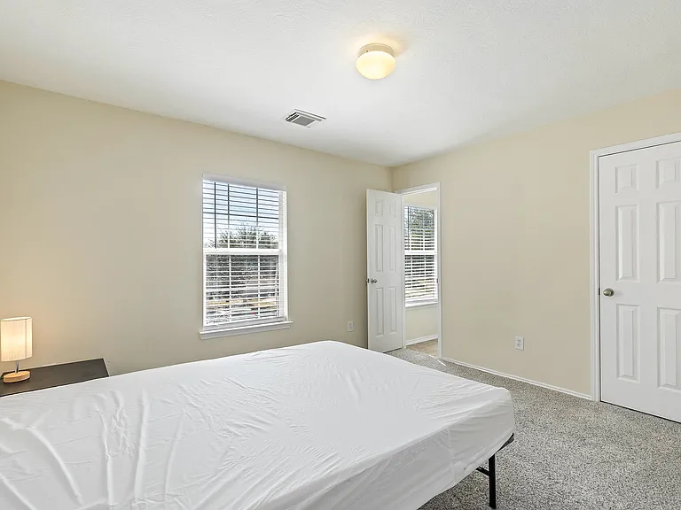 Beautiful room, Plush carpet w nightstand! Lamp is LED with charge port. Comes with walkin closet! Jack N Jill Bath is a plus