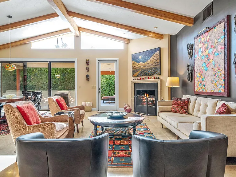 Sunny great room with cathedral ceiling.
