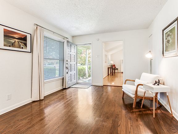 Entrance - spacious front room with a large window view to patio