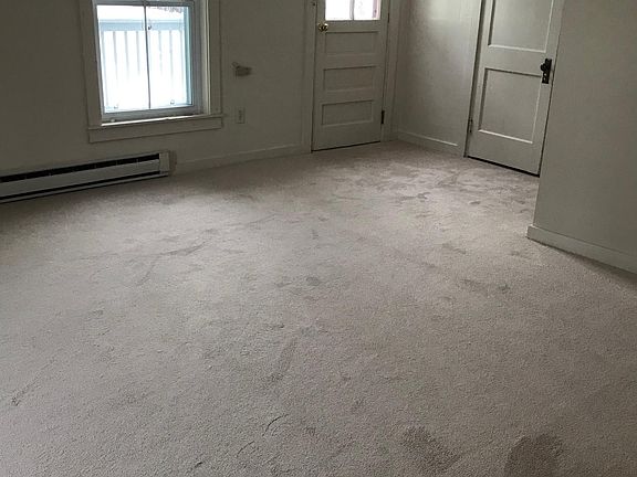 Master bedroom with closet, en suite, 1 year old carpeting, walk out to small deck.