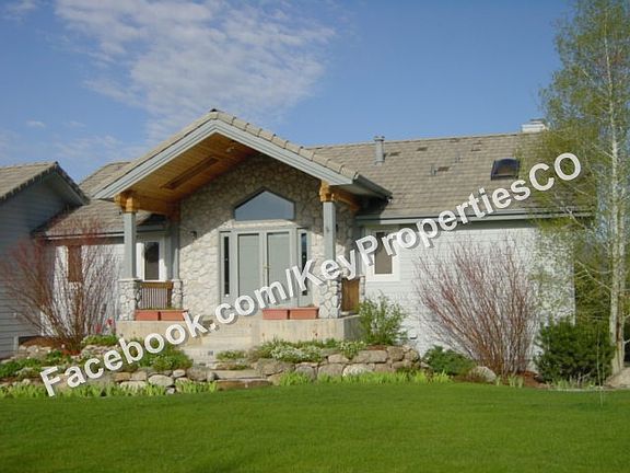 Home Front with covered sitting porch, eave lighting & outlets
