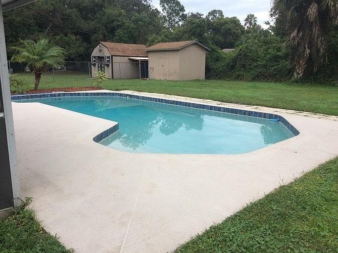 Large storage shed with lock in back yard