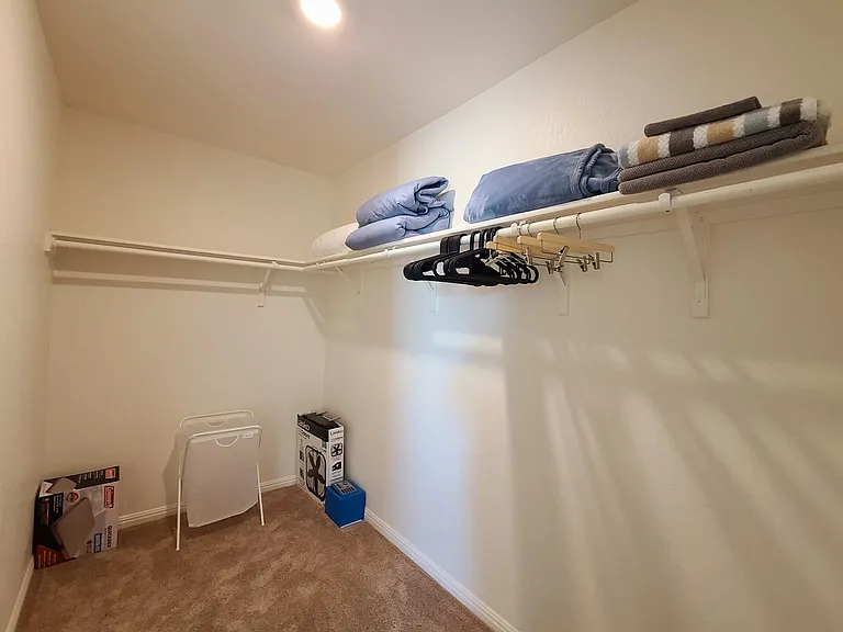 Huge walk-in closet in the bedroom #1
