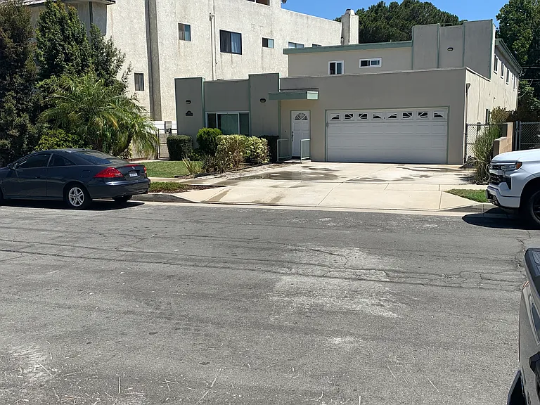 front of 4 plex, front door to owners unit #1. Left side of front garage for parking/storage and tandem on driveway
