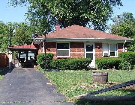 Classy brick home with carport in Washington schools