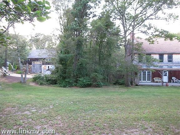 Both house and guest house from front lawn.