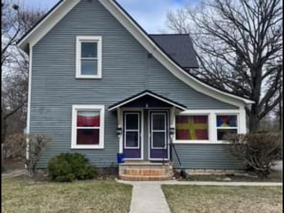 Front of house. Upper unit is accessed by door to the left. Porch has been rebuilt since this pic was taken