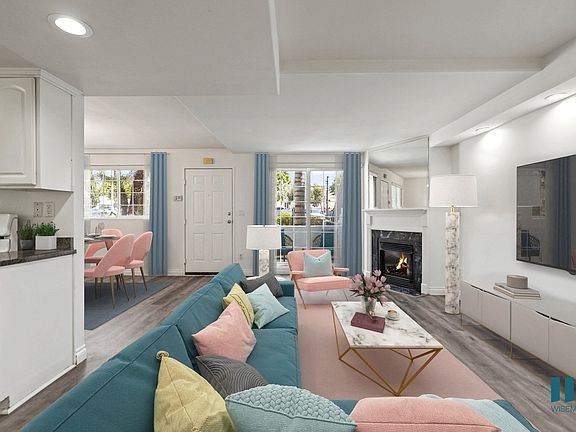 Open-Concept Kitchen, Dining, and Living Room with Electric Fireplace and Large-Size Windows