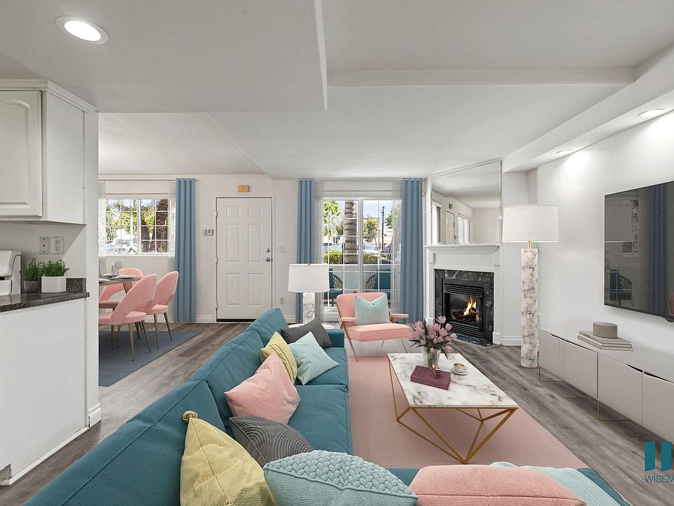 Open-Concept Kitchen, Dining, and Living Room with Electric Fireplace and Large-Size Windows