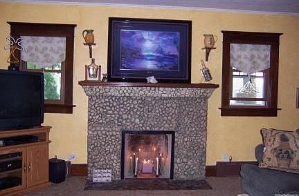 Stone Fireplace in living room
						:
						Great focal point with wood mantle to display your favorite artwork.