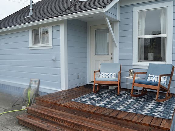 Back porch overlooking fenced yard