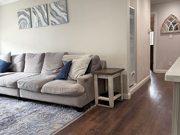 Hallway leading to 3 bedrooms and bathroom