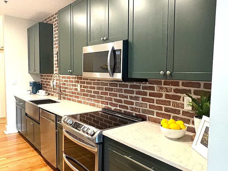 Kitchen fully stocked with dishes, glassware, utensils, hand appliances, pots & pans, knives, cleaning supplies, spices,...
