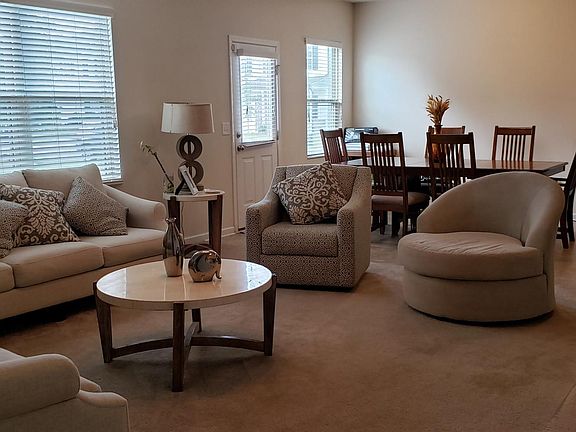 Family Room + Dining Area seen in the back