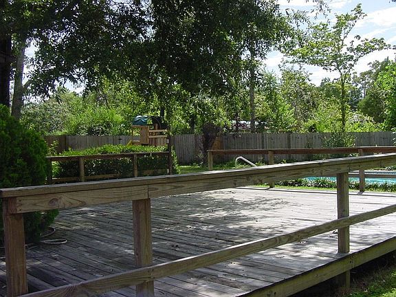 backyard deck, swingset and pool