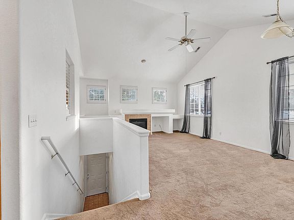Top of the Stairs, looking into the Open Floor Plan Living Area with Lots of Natural Light.