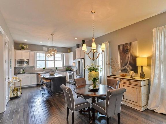The dining area flows in the chief_s kitchen