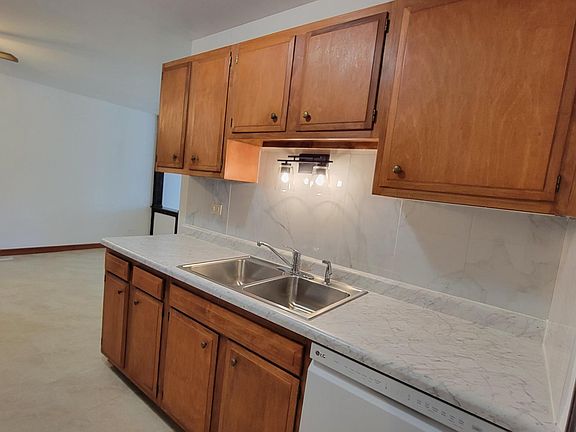 View of Kitchen. New countertops, backsplash, sink, lighting and brand new dishwasher