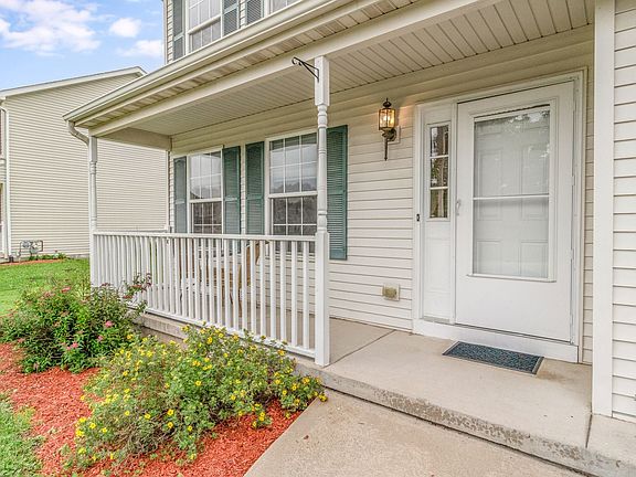 Welcoming front with covered porch!
