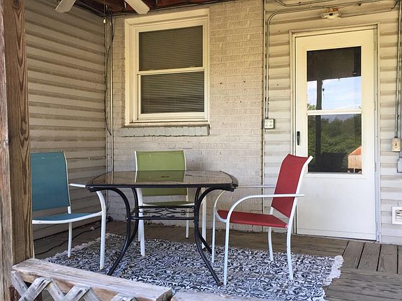 Covered deck overlooks backyard