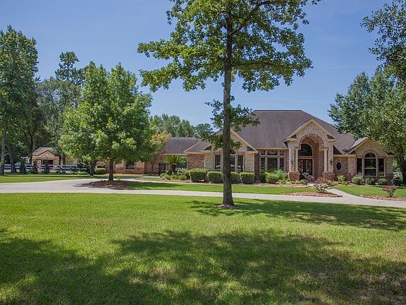 Manicured lawn, mature trees and blooming landscaping welcome you home...