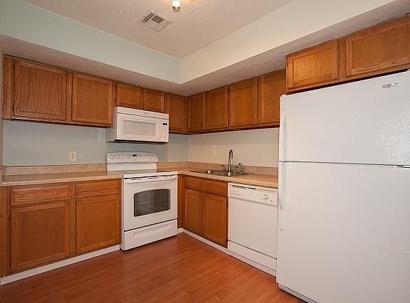 Laminate wood flooring in living and kitchen