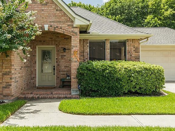 Lovely brick-paved, covered entry