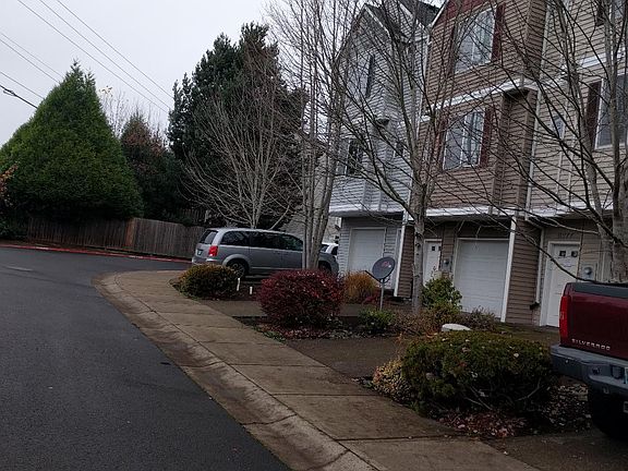 Far end unit with car in driveway 3 bdrm 2 1/2 bath, double long garage, fenced back yard