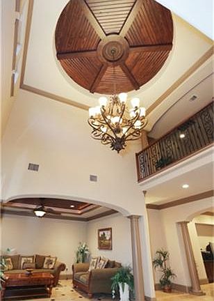 The entrance foyer dome was custom handcrafted using imported woods.