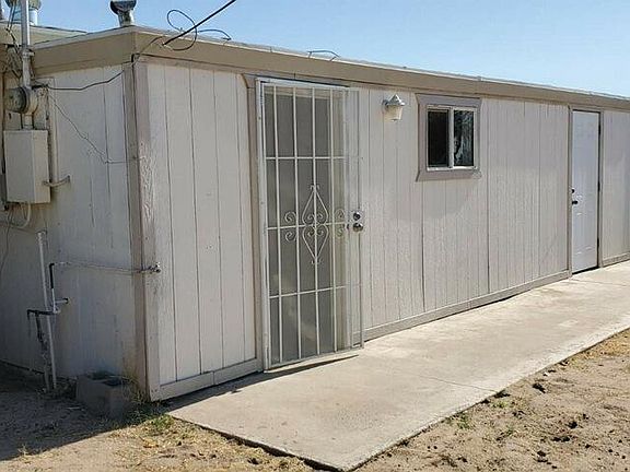 Back of House with enclosed storage shed