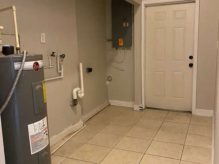 Laundry room at back with accress to backyard