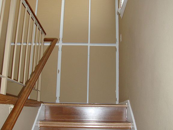 STAIRCASE WITH STORAGE CABINETS