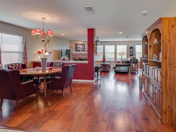 From entry way looking toward the Open formal dining and Living area.  All  upgraded solid Wood Floors!