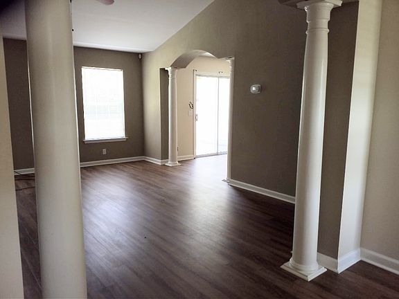 View of living room from foyer. LVP planks through the whole house.