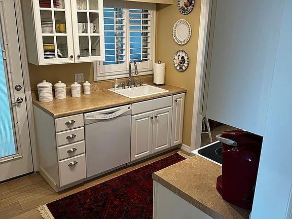 Updated kitchen, including a in unit washer and dryer. Storage closet for beach gear right outside kitchen door.