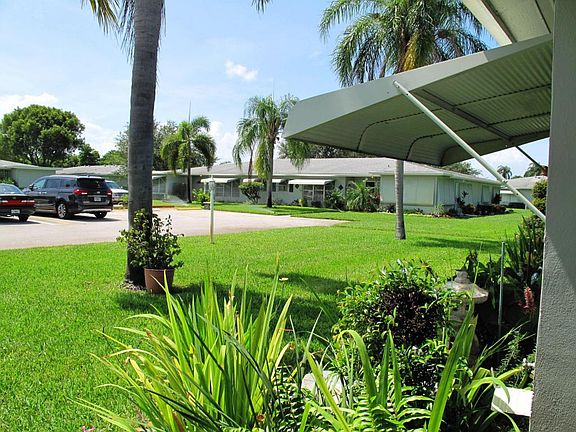 View of front lawn and parking area