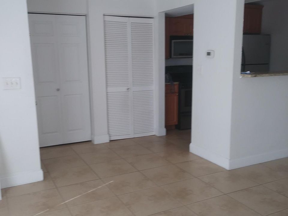 View from door entrance leading to kitchen and living room.