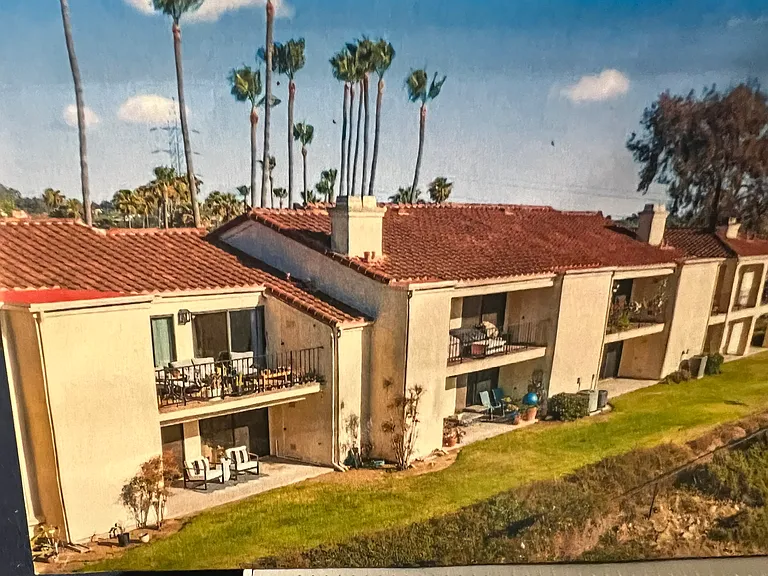 Back side of building, bottom left shows patio of condo unit