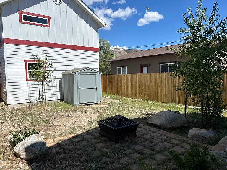 Backyard with patio, fire pit and shed