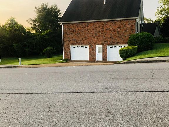 Garage is on the right side of the house.