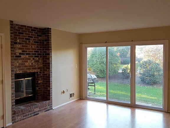 Living room with a patio door to nice backyard