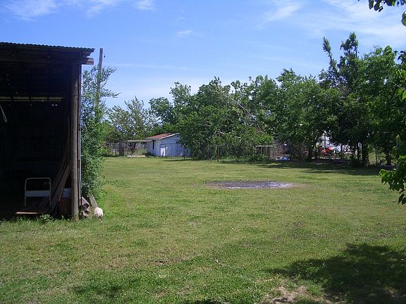back yard, pole barn to left