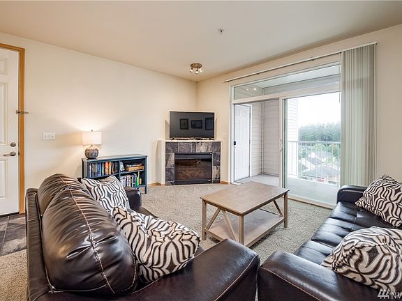 Living room has slider to covered balcony